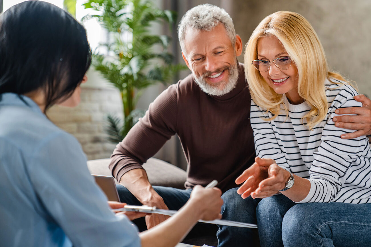 Couple signing on new home lease